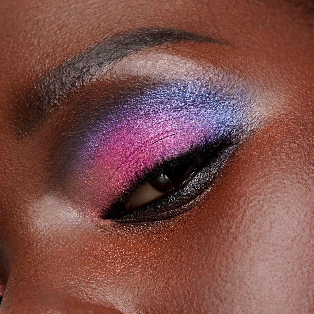 Close-up of a person's eye with colorful makeup