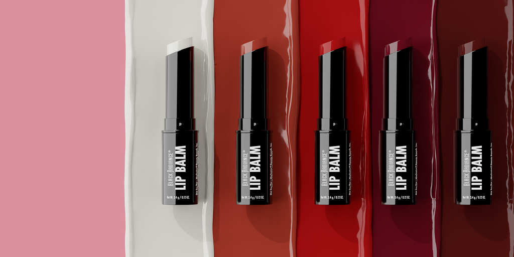 Five lip balm containers on a red and white background